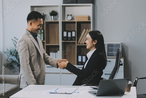 Business handshake for teamwork of business merger and acquisition,successful negotiate,hand shake,two businessman shake hand with partner to celebration partnership and business deal concept