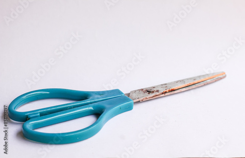 Old blunt and rusty scissors isolated white background.concept of home equipment used daily in tailor work