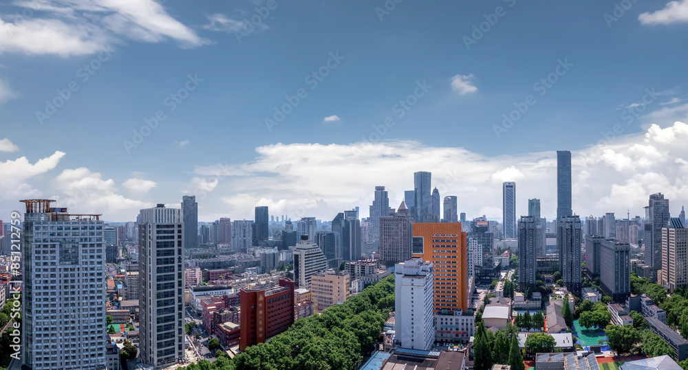 Fototapeta premium Vibrant Urban Skyline Under Blue Skies