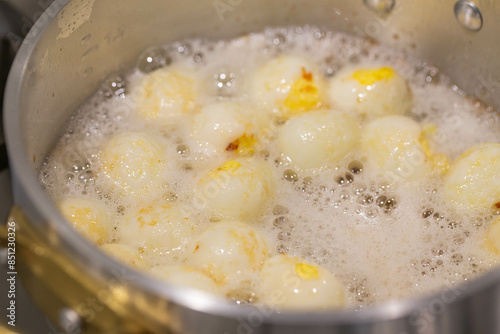 Boiled quail eggs with water and then fried them with oil in the pan.