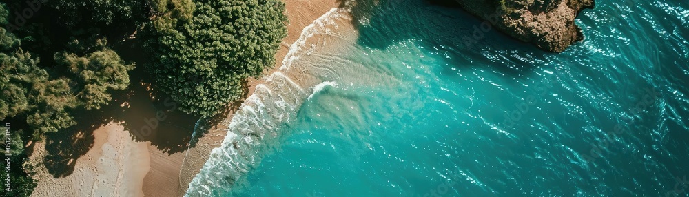 Aerial view of a serene tropical beach with turquoise waters, golden sand, and lush green foliage, perfect for a relaxing getaway. Aerial view of a serene tropical beach with turquoise waters, golden sand, and lush green foliage, perfect for a relaxing getaway.