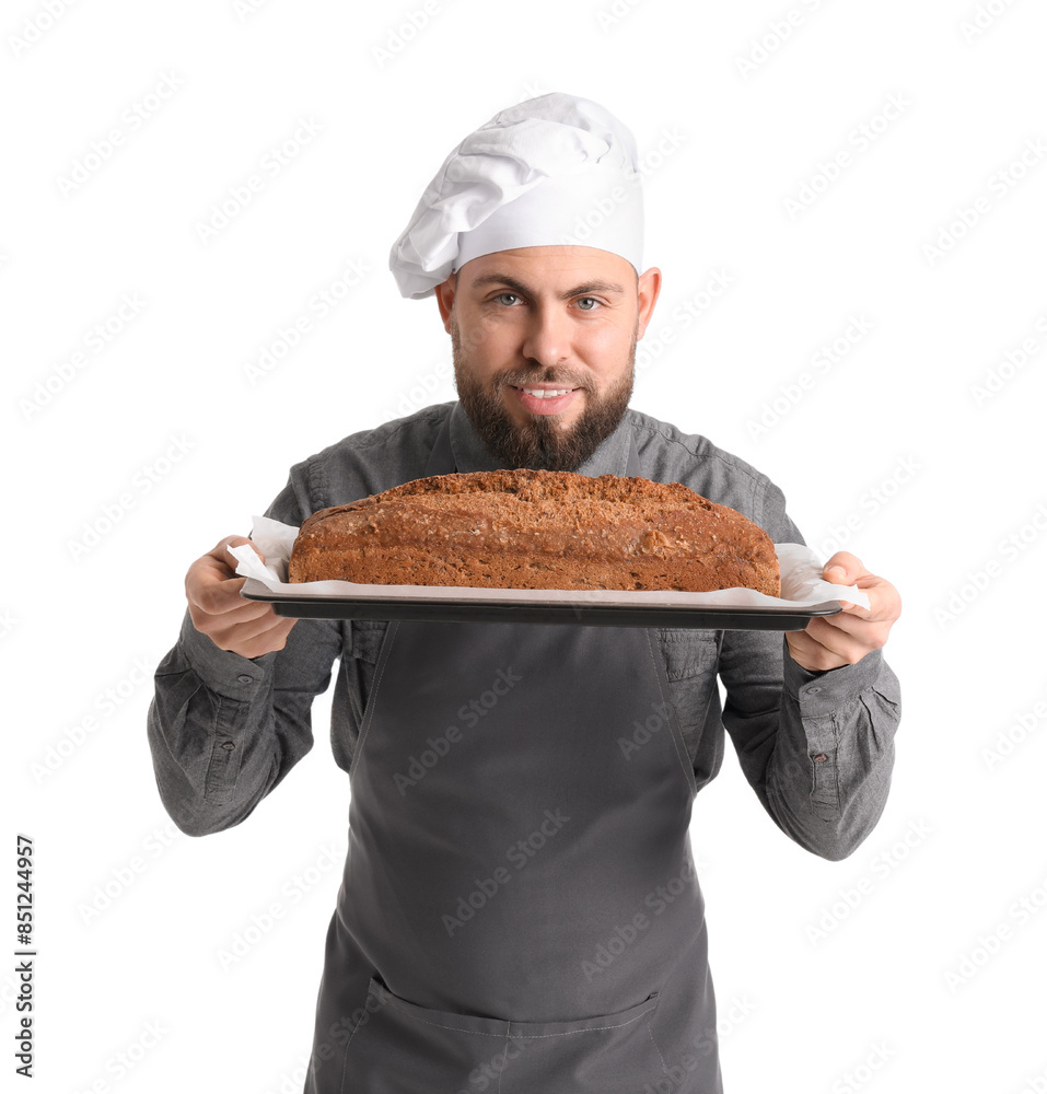 Male baker holding tray with rye bread on white background Male baker holding tray with rye bread on white background