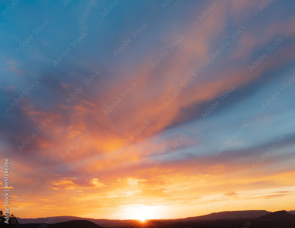 Dazzling and beautiful wide angle colorful sunset with dramatic sky and clouds in Sedona, Arizona. Dazzling and beautiful wide angle colorful sunset with dramatic sky and clouds in Sedona, Arizona.