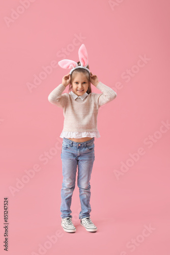 Cute little girl in bunny e...
