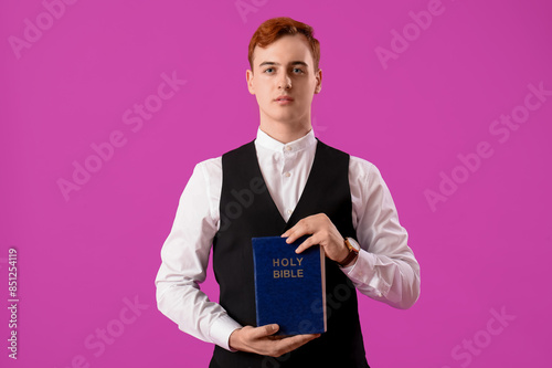 Young redhead man with Bibl...