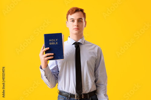 Young redhead man with Bibl...
