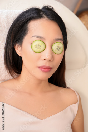 Young Asian woman with cucu...