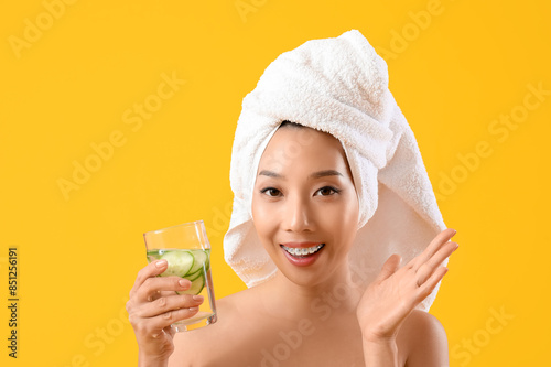 Young Asian woman with glas...