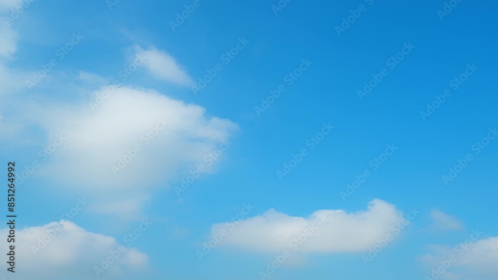 A clear blue sky with fluffy white clouds scattered across. The vibrant blue hue and soft clouds create a calming and serene atmosphere, perfect for a sunny day. Wonder of nature background.
A clear blue sky with fluffy white clouds scattered across. The vibrant blue hue and soft clouds create a calming and serene atmosphere, perfect for a sunny day. Wonder of nature background.