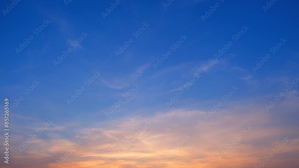 A serene sunset with a gradient sky transitioning from deep blue at the top to warm orange and yellow hues near the horizon. Wispy clouds add texture to the peaceful scene. Cloud background.
A serene sunset with a gradient sky transitioning from deep blue at the top to warm orange and yellow hues near the horizon. Wispy clouds add texture to the peaceful scene. Cloud background.