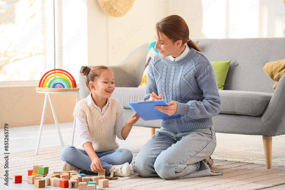 © Pixel-Shot - Female psychologist working with cute little girl in office © Pixel-Shot - Female psychologist working with cute little girl in office