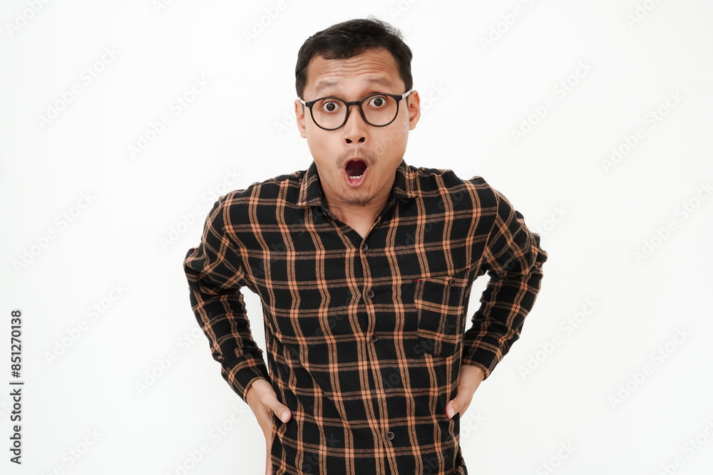 a man wearing a flannel shirt, wearing glasses with a shocked expression a man wearing a flannel shirt, wearing glasses with a shocked expression