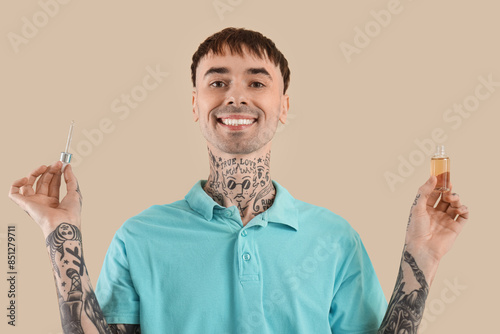Young tattooed man with bot...