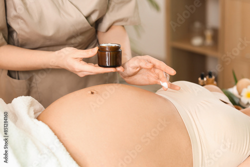 Massage therapist applying ...