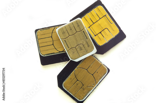 Naklejka Four SIM cards on a white background close-up