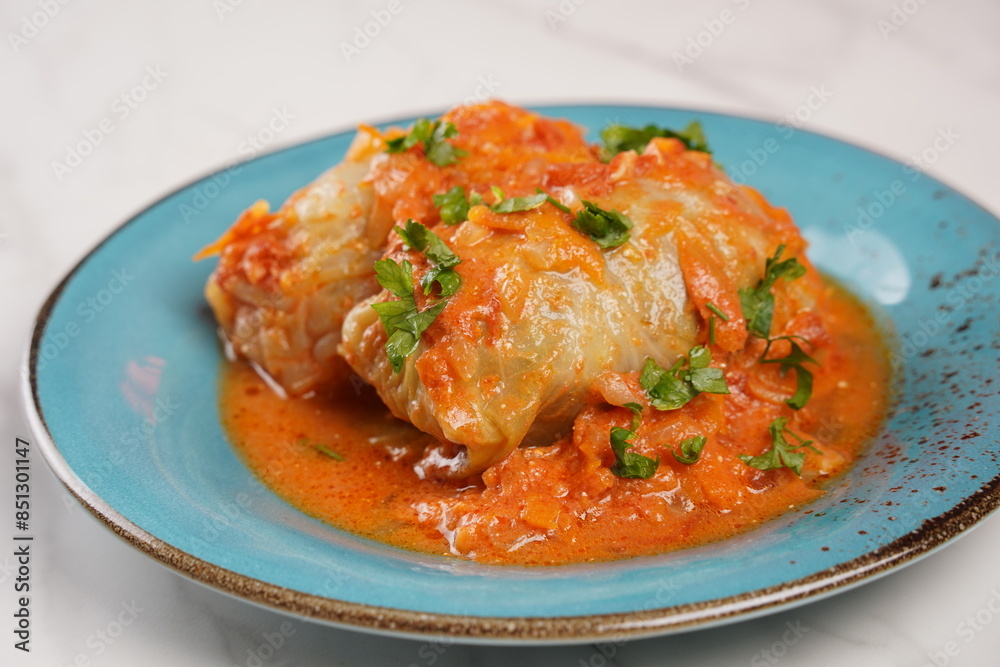 Cabbage rolls with chicken meat and rice in tomato sauce. Stuffed cabbage leaves. Delicious dinner Cabbage rolls with chicken meat and rice in tomato sauce. Stuffed cabbage leaves. Delicious dinner