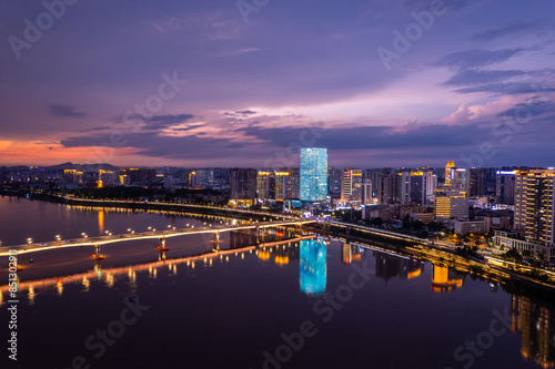 Aerial photography of the night scene on the east bank of the Xiangjiang River in Zhuzhou, China photo