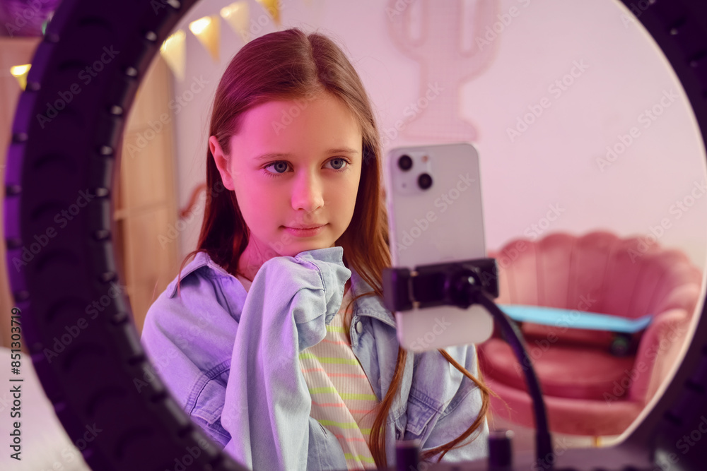 Teenage blogger recording video in bedroom, closeup Teenage blogger recording video in bedroom, closeup