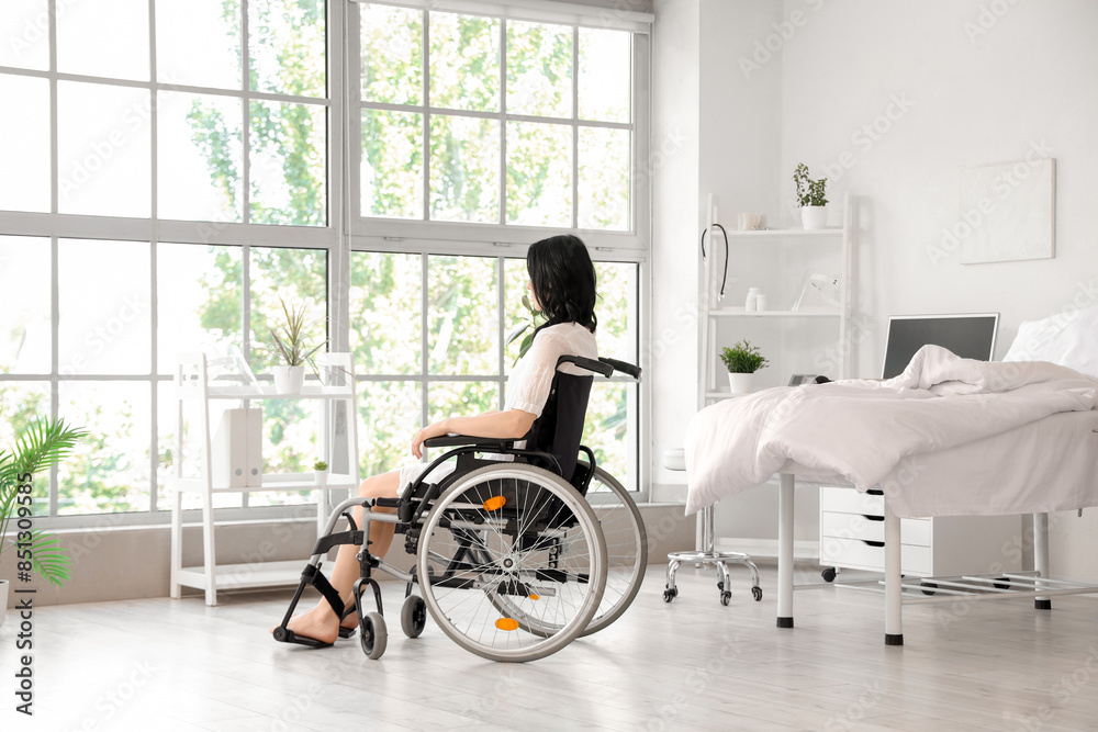 Female patient in wheelchair at hospital ward Female patient in wheelchair at hospital ward