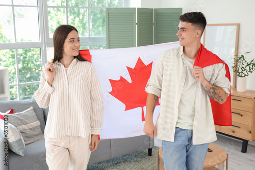 Young couple with flag of C...