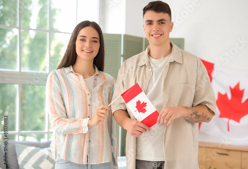 Young couple with flag of C...