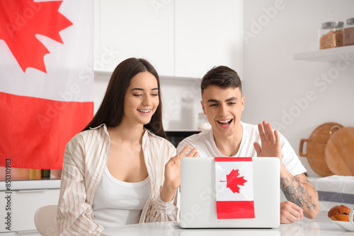 Young couple with flag of C...