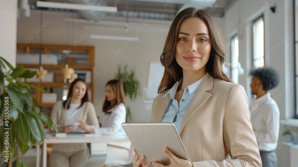 Fototapeta premium The confident businesswoman with tablet