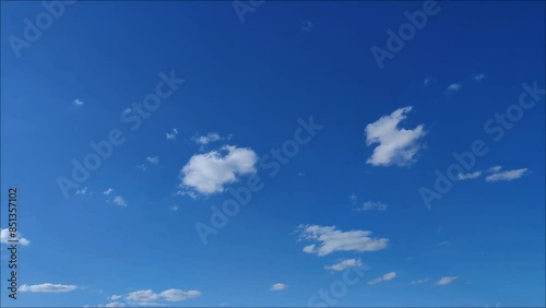 Curious and beautiful landscape of small clouds moving through the blue sky in the afternoon