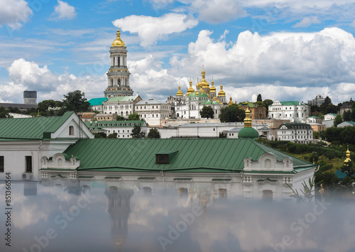 View of the upper Kyiv Pechersk Lavra against the background of a beautiful sky with clouds photo