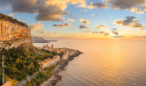 Obraz na płótnie Aerial view showcasing its historic architecture, stunning coastline, and Mediterranean charm of Cefalu at sunset, Sicily. w salonie