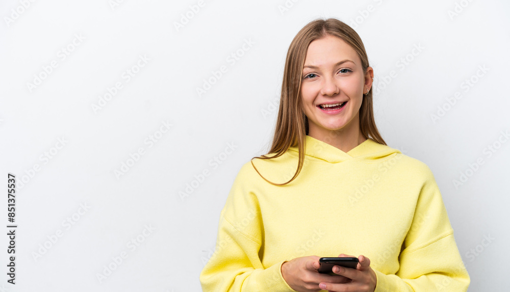 Young Russian woman isolated on white background surprised and sending a message Young Russian woman isolated on white background surprised and sending a message
