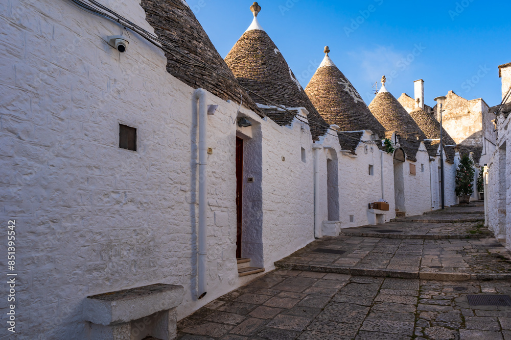Famous historical old dry stone trulli houses with conical roofs in Alberobello, Italy.
