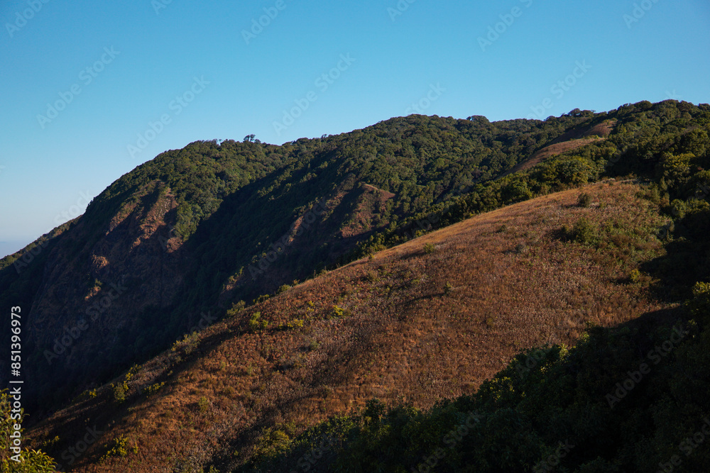 Landscape with blue sky. Mountainscape at Kew Mae Pan, Chiang Mai. Photographed in March 2020. Landscape with blue sky. Mountainscape at Kew Mae Pan, Chiang Mai. Photographed in March 2020.