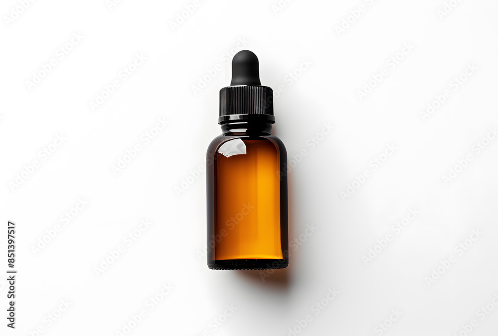 Amber glass dropper bottle with black cap isolated on white background Amber glass dropper bottle with black cap isolated on white background