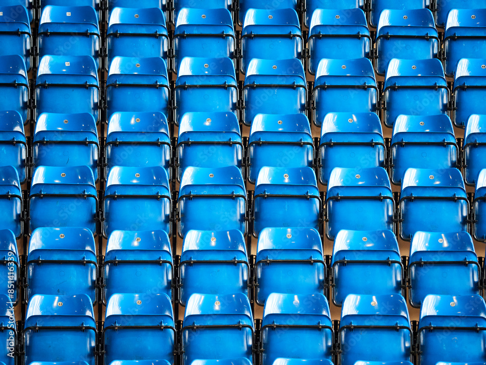Rows of plastic seats with numbers in a sports arena Rows of plastic seats with numbers in a sports arena