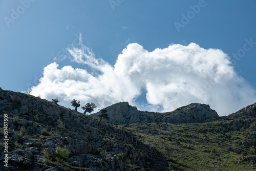 snowy peaks of mountains, clouds, wonderful and mystical landscapes photo