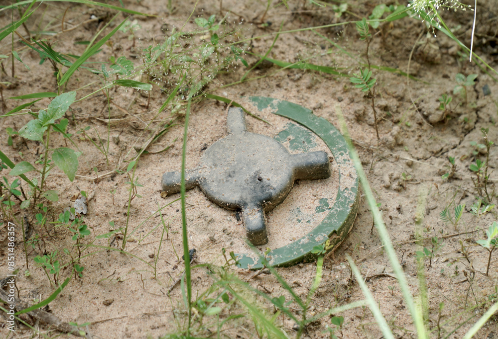 Naklejka premium Dangerous old landmines on ground in Cambodia