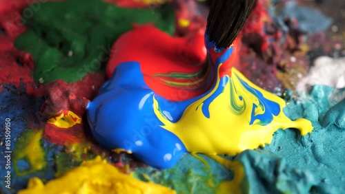 painting with brush on palette. 4k slow motion footage
