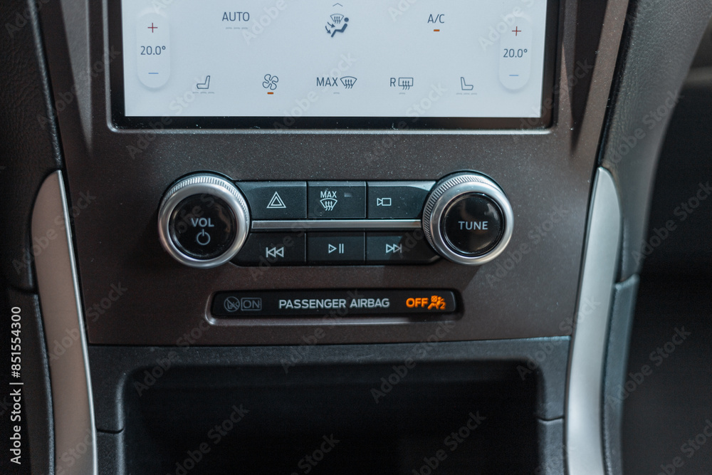 Fototapeta premium Car interior with sensors, display and adjustments, sound and radio controlс