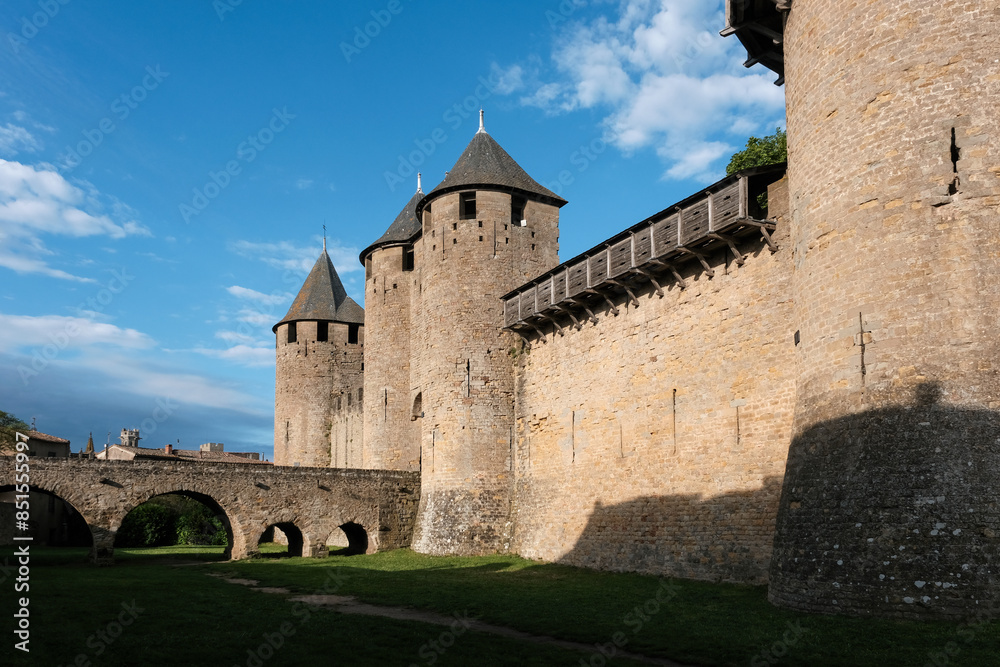 View of Comtal Castle of Carcassonne Fortress on sunny morning, France. View of Comtal Castle of Carcassonne Fortress on sunny morning, France.