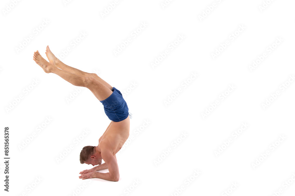 A young attractive man is doing yoga. White background. A young attractive man is doing yoga. White background.