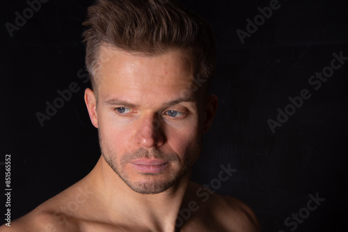 Young attractive man posing over white background.