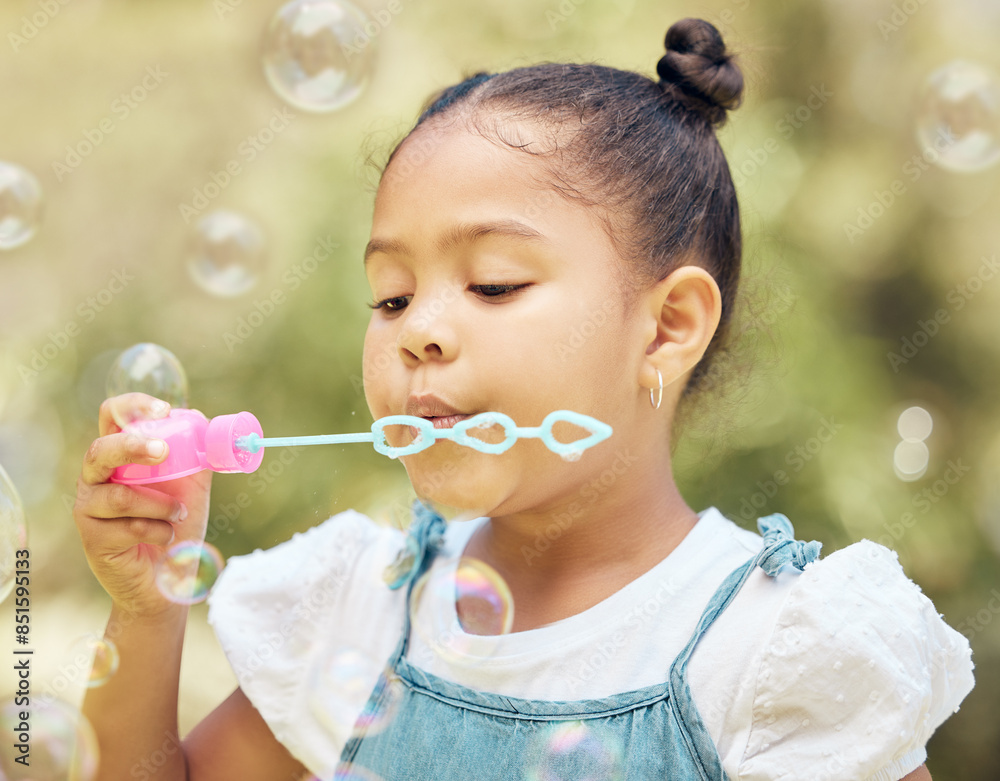 Kid, girl and blowing bubbles in outdoor park for playing, development or activity. Summer, freedom and young child with soap toy for entertainment, having fun or enjoyment on weekend in backyard Kid, girl and blowing bubbles in outdoor park for playing, development or activity. Summer, freedom and young child with soap toy for entertainment, having fun or enjoyment on weekend in backyard