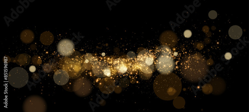 A luminous bokeh that gently shimmers with golden light. Light abstract glowing lights. Glowing bokeh effect isolated on dark background. Christmas background made of glowing dust.	