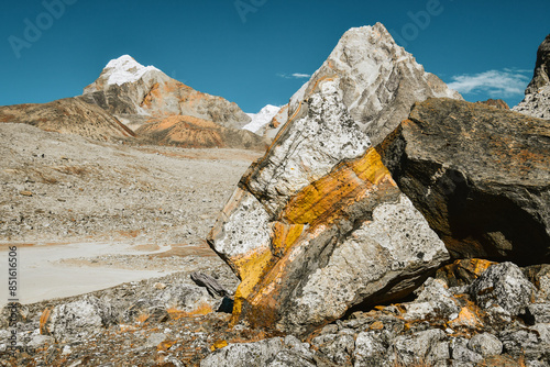 Colorful stunning beautiful rock formations form in high altitude Himalayas mountains. Close up EBC trekking detour route to Gokyo Ri through Chola pass photo