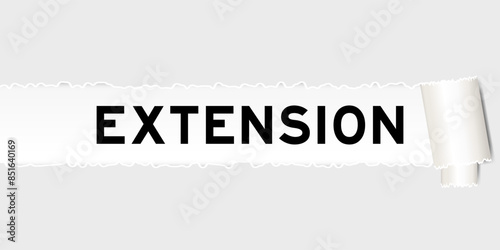 Ripped gray paper background that have word extension under torn part