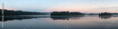 panorama of a forest lake with fog