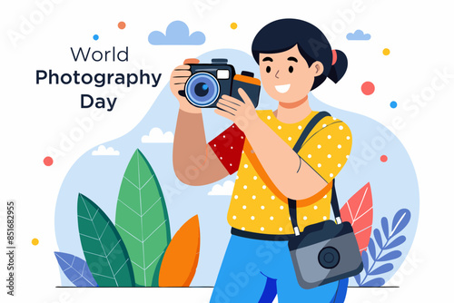  A skilled photographer holding a camera in hand, stands against a dotted white backdrop. World photographer day
