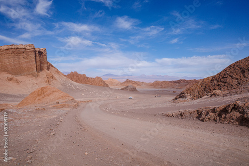 Fototapeta Naklejka Na Ścianę i Meble -  San Pedro de Atacama, Chile - Nov 29, 2023: Sand dunes and rock formations in the Valley of the Moon, Atacama Desert