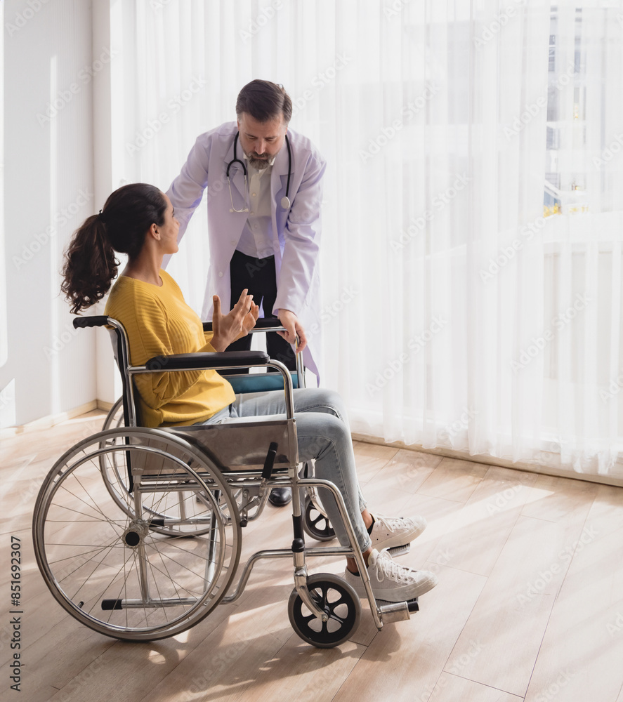 Portrait health care latin woman sick sit wheelchair with man doctor caucasian two people check and treat patients talk help support explain medicine sick person inside hospital clinic room service. Portrait health care latin woman sick sit wheelchair with man doctor caucasian two people check and treat patients talk help support explain medicine sick person inside hospital clinic room service.